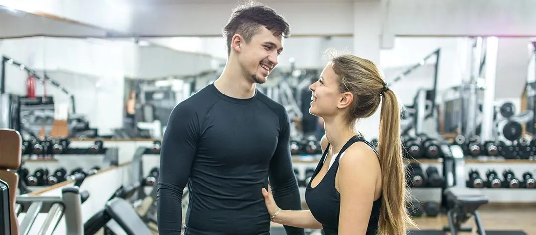 Robert and Claire looking each other, MyGym owners